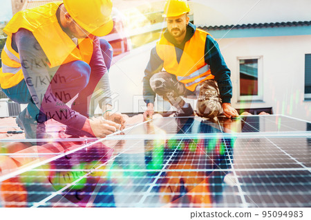 Workers assemble energy system with solar panel for electricity Workers assemble energy system with solar panel for electricity 95094983
