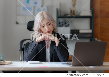 Accountant checking data document on laptop for investigation of corruption account Accountant checking data document on laptop for investigation of corruption account 95095148