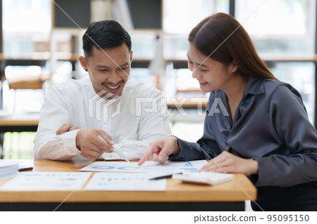 Two asian fund manager brainstorming new business project finance investment concept Two asian fund manager brainstorming new business project finance investment concept 95095150