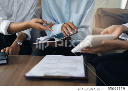 Young couple consultations with a insurance agent. saving and insurance concept Young couple consultations with a insurance agent. saving and insurance concept 95095159