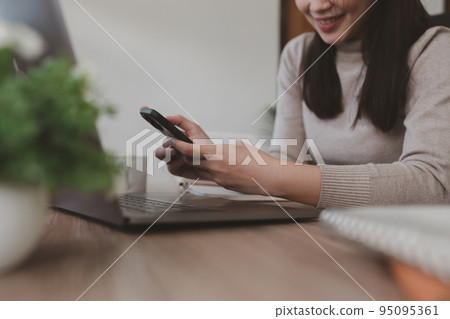 Woman Completes KYC using an online banking app in order to open a digital savings account. The definition of cyber security Woman Completes KYC using an online banking app in order to open a digital savings account. The definition of cyber security 95095361