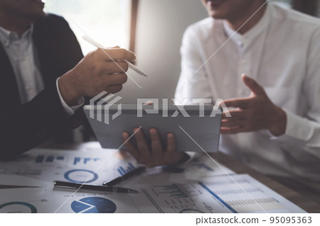 Group of IT consultant working by tablet and management big data and analyze financial document of company Group of IT consultant working by tablet and management big data and analyze financial document of company 95095363