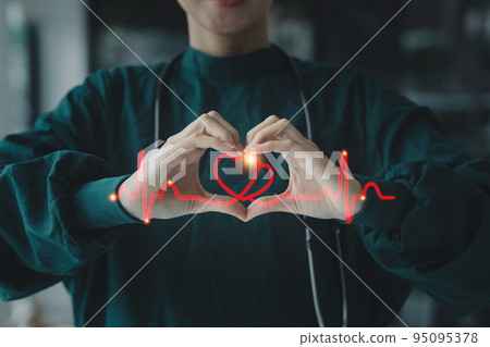 Cardiologist holding red heart in private clinic. Medical technology diagnostics of heart concept Cardiologist holding red heart in private clinic. Medical technology diagnostics of heart concept 95095378