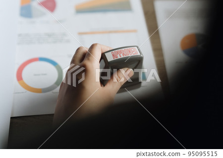 Business Accountant woman Hand Stamping On Approved Contract Form. finance concept Business Accountant woman Hand Stamping On Approved Contract Form. finance concept 95095515