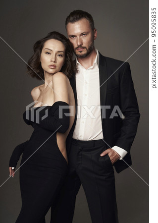 Fashion studio photo of a sensual couple 95095835