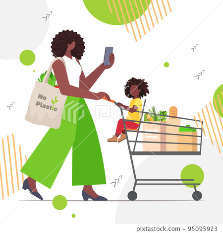 woman pushing trolley cart with daughter and eco friendly natural bags sustainable lifestyle package free food shopping woman pushing trolley cart with daughter and eco friendly natural bags sustainable lifestyle package free food shopping 95095923