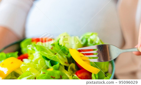 Pregnant healthy food diet. Pregnancy woman eating nutrition diet food salad. Healthy vegetarian food, healthy lifestyle. 95096029