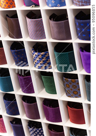 View of different colors ties in showcase. View of different colors ties in showcase. 95096855