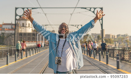 Happy Traveller man on the Oporto bridge 95097283