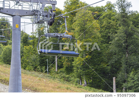 lifts of the mountain cable car on the background of mountains lifts of the mountain cable car on the background of mountains 95097306