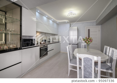 Interior of modern trendy white kitchen Interior of modern trendy white kitchen 95097336