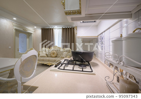 Worktop closeup of white rich classic white kitchen 95097343