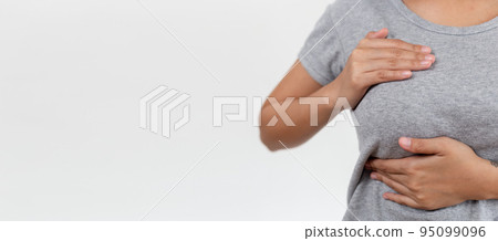 Close-up Woman hand touching her breast screening by self. Close-up Woman hand touching her breast screening by self. 95099096