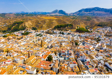 View from drone of Antequera overlooking Castle and church of San Sebastian, Spain 95101679