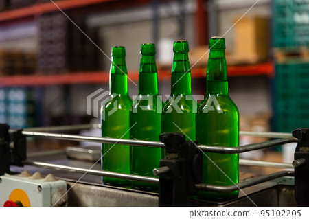 Bottles of cider on bottling line Bottles of cider on bottling line 95102205