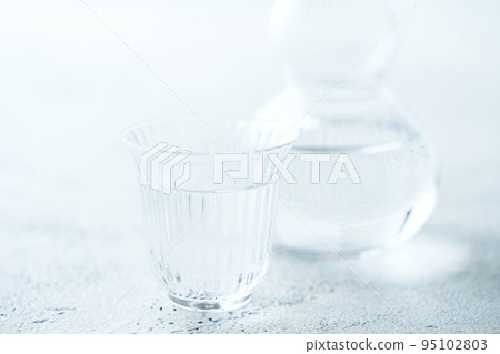 Japanese sake poured into the sake cup of the glass 95102803