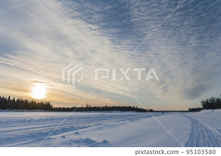 sunset over frozen river sunset over frozen river 95103580