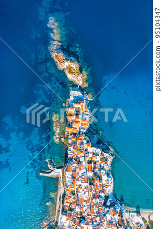 View of Chora town on the beautiful Andros island in Cyclades, Greece, Europe 95104347