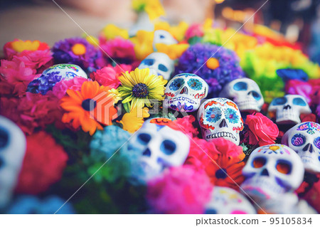 Colorful candy sugar skulls with flowers on Day of the Dead festival in Mexico. Colorful candy sugar skulls with flowers on Day of the Dead festival in Mexico. 95105834