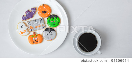 hot coffee cup with funny Halloween Cookies. Happy Halloween day, Trick or Threat, Hello October, fall autumn, Traditional, party and holiday concept 95106954