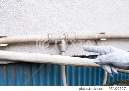 Housing Exterior wall piping of a deteriorated old house 95109527