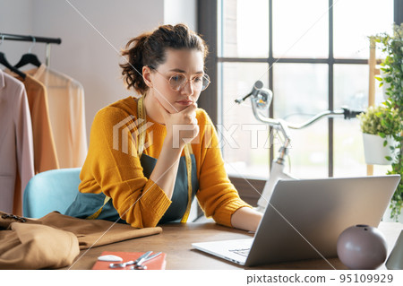 Woman is working at workshop Woman is working at workshop 95109929