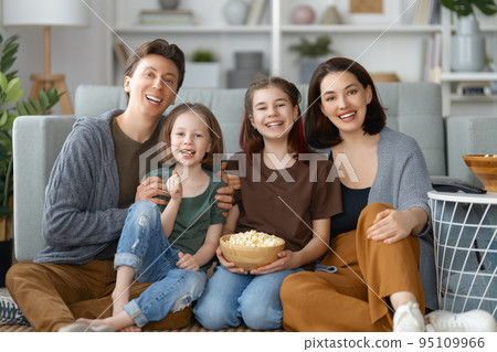 Mother, father and daughters spending time together. 95109966