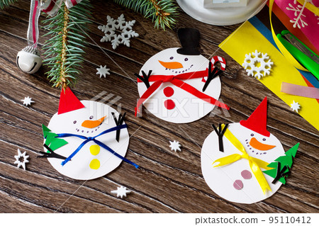 Christmas snowman merry gift. Handmade. Project of children's creativity, handicrafts, crafts for kids. 95110412