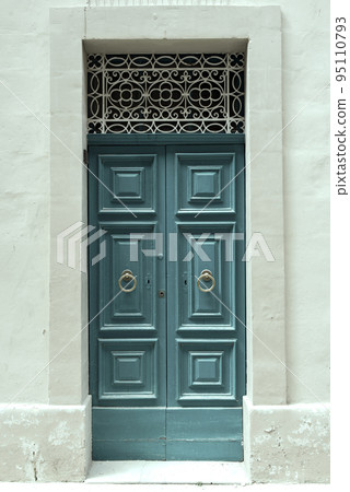 Traditional wooden painted blue door in Malta 95110793