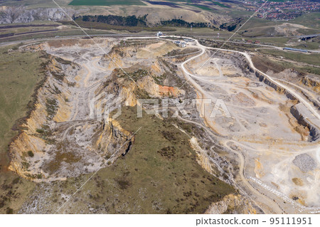 Aerial drone view of a limestone quarry, open pit mine 95111951