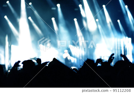 Rear view of crowd with raised arms at a concert Rear view of crowd with raised arms at a concert 95112208