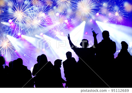 New Year concept. Celebrating crowd and fireworks New Year concept. Celebrating crowd and fireworks 95112689
