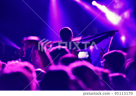 Crowd at a music concert, audience raising hands up Crowd at a music concert, audience raising hands up 95113170