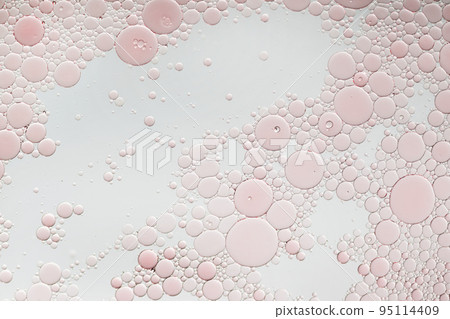 Abstract pink oil bubbles background. Cosmetic liquid beauty product. Abstract pink oil bubbles background. Cosmetic liquid beauty product. 95114409