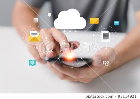 Cloud computing is a network of smartphones and online devices that upload information and data to a database with a business icon. 95114921