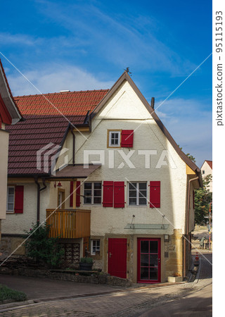 Traditional small house with beautiful outdoor decor facade in Germany. German old brick building house ancient European city German architect 95115193