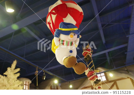 snowman flying in the sky snowman flying in the sky 95115228
