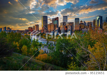 Sunset above city skyline of Calgary with Bow River, Canada 95115651