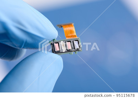 Scientist hold in fingers fitness tracker smart watch component with different sensor array 95115678