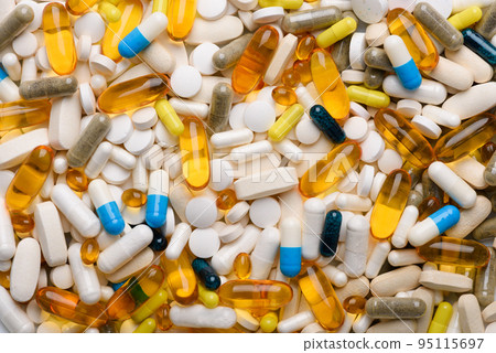 Different medication and supplements pills and capsules assortment background texture top view Different medication and supplements pills and capsules assortment background texture top view 95115697
