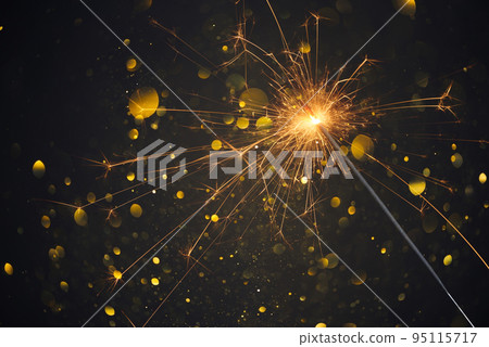 Happy New Year, Sparkler burning bright with shiny sparks and bokeh festive silvester party  95115717