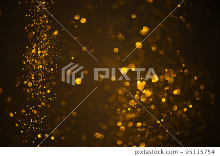 Warm glowing golden glitter festive lights abstract bokeh dark background Warm glowing golden glitter festive lights abstract bokeh dark background 95115754