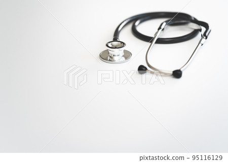 A stethoscope placed on a white table Medical image A stethoscope placed on a white table Medical image 95116129