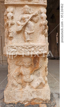 Sculpture of Goddess Sarshwati holding a harp and demons at bottom of pillar, at Shesharayar Mandapam, Sri Ranganathaswamy Temple, Srirangam, Trichy, Tamil Nadu, India Sculpture of Goddess Sarshwati holding a harp and demons at bottom of pillar, at Shesharayar Mandapam, Sri Ranganathaswamy Temple, Srirangam, Trichy, Tamil Nadu, India 95116462