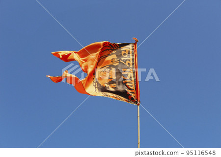 Chatrapati Shivaji Maharaj picture on orange cotton flag, Lohgad Fort, Pune, Maharashtra, India Chatrapati Shivaji Maharaj picture on orange cotton flag, Lohgad Fort, Pune, Maharashtra, India 95116548