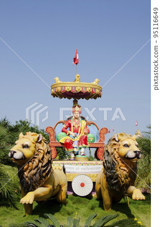 Colourful idol of Bhagwan Shri Swaminarayan at Nilkanthdham, an extensive religious complex with pagodas, fountains, statues & carved idols and gates, located at Poicha, Gujarat, India Colourful idol of Bhagwan Shri Swaminarayan at Nilkanthdham, an extensive religious complex with pagodas, fountains, statues & carved idols and gates, located at Poicha, Gujarat, India 95116649