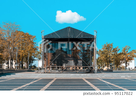 Autumnal city square with a concert stage 95117022