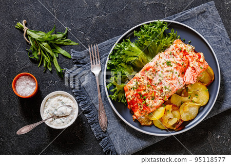 salmon with potato and tarragon sour cream sauce salmon with potato and tarragon sour cream sauce 95118577