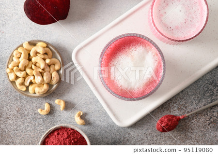 Healthy vegan beetroot latte with cashew nuts milk. View from above. Healthy vegan beetroot latte with cashew nuts milk. View from above. 95119080