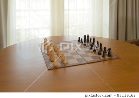 A chess game or chessboard at home. lifestyle. Activity in business concept. A chess game or chessboard at home. lifestyle. Activity in business concept. 95119162